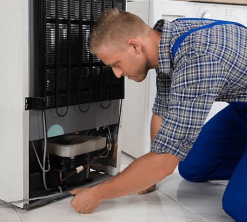 Cape Fridge Care technicians servicing a commercial display fridge in Cape Town Cape Fridge Care technicians servicing a commercial display fridge in Cape Town